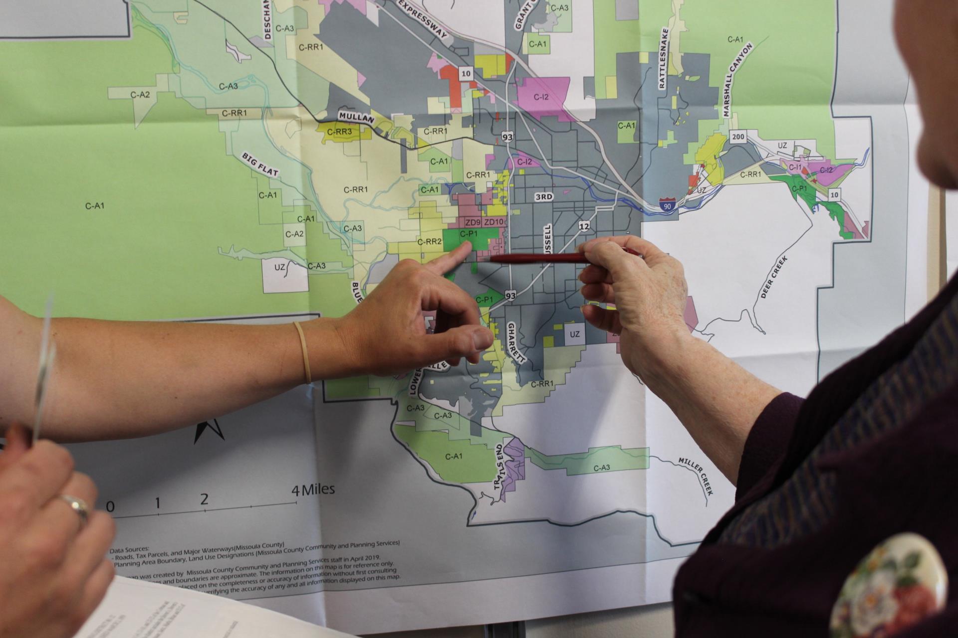 County Planning staff reviewing a map with the public