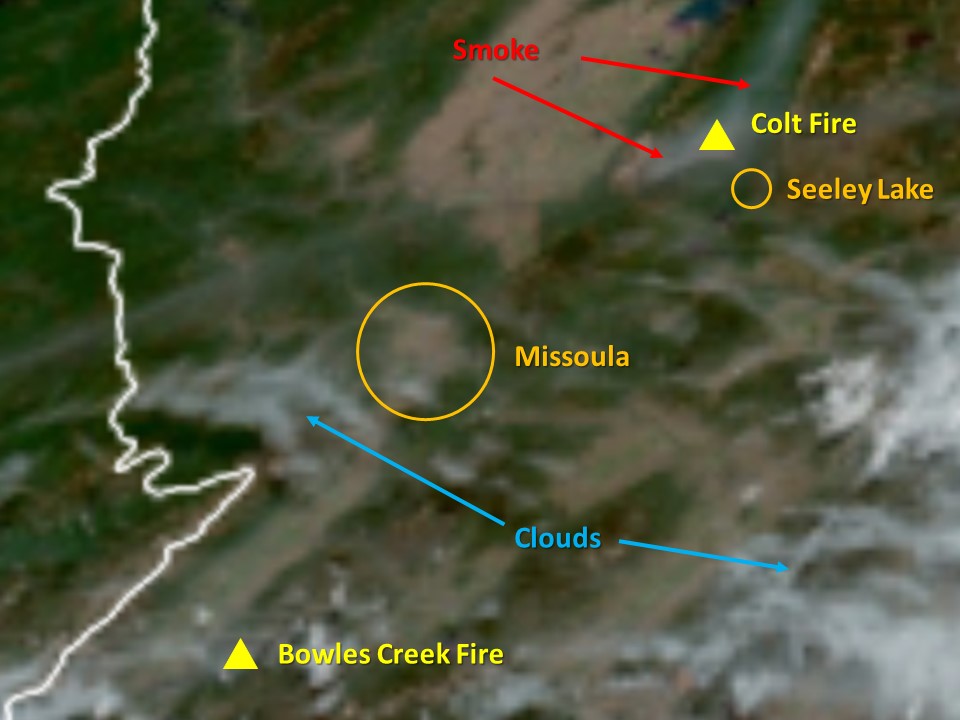 A satellite photo showing wildfire smoke in the Swan Valley and clouds scattered over Western Montana