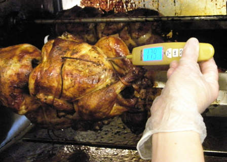 Proper Cooking involved checking the internal temperature of food, such as the chicken shown in this photograph. 