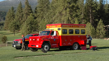 Search and Rescue vehicles within Missoula County forested area. 